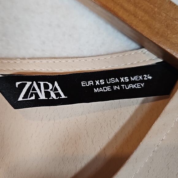 Zara Blush Beige Short Sleeve Asymmetrical Pleated Hem Blouse - Picture 4 of 8